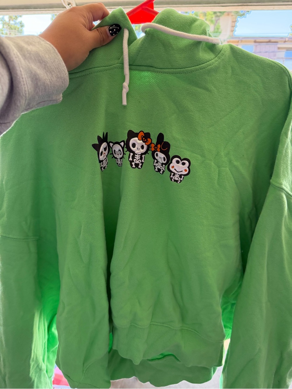 Green Hoodie with Cute Skeleton Character Row